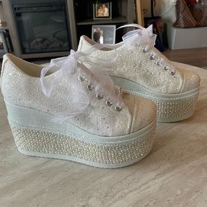 White, sparkly, wedged sneaker in a size 7 1/2